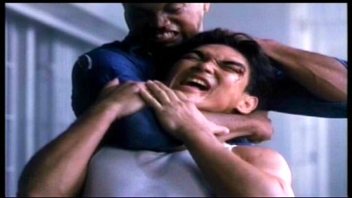 Bloodfist III: Forced to Fight - Jimmy Boland (Don 'The Dragon' Wilson) on the receiving end of some unkindness from Blue (Gregory McKinney) Bloodfist III: Forced to Fight - Jimmy Boland (Don 'The Dragon' Wilson) on the receiving end of some unkindness from Blue (Gregory McKinney)