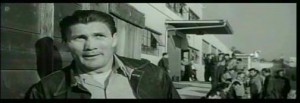 House of Numbers #2 - House of Numbers - Jack Palance as Arnie Judlow, this time, speaking out of the side of his mouth to Bill, who is concealed in the crate 